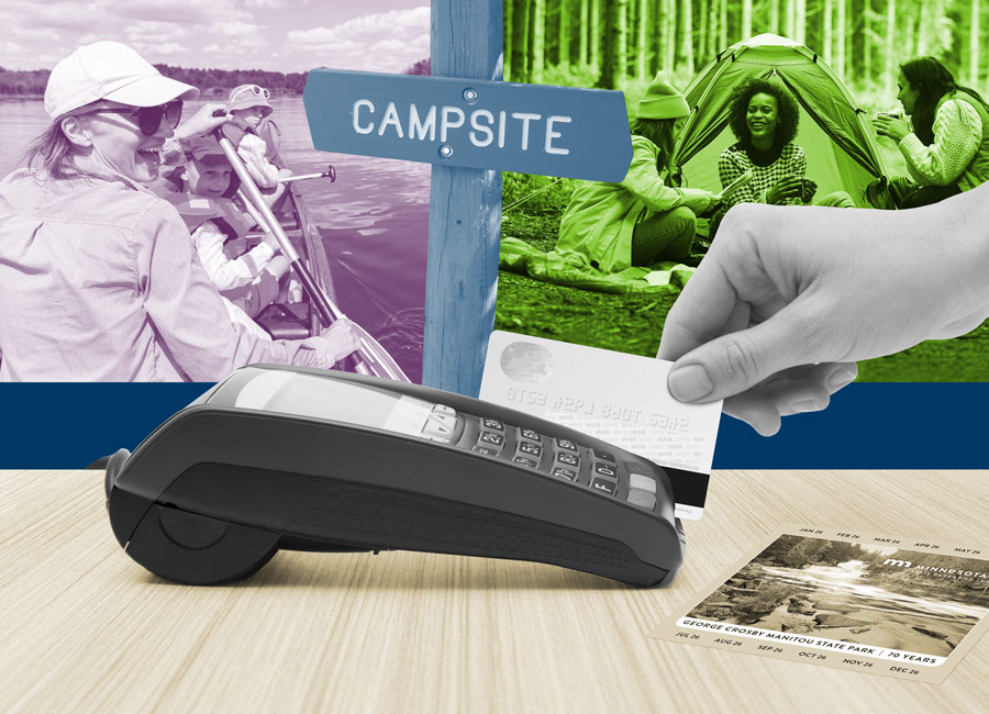 A hand using a credit card terminal