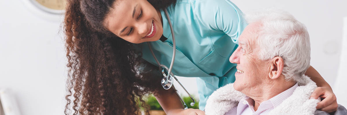 A nurse checking on a patient.